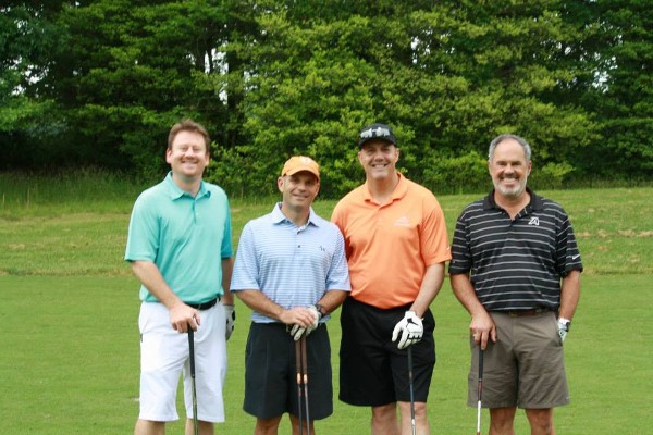 A team takes the course during the chapter’s golf tournament in May, which raised funds for scholarships and grants.